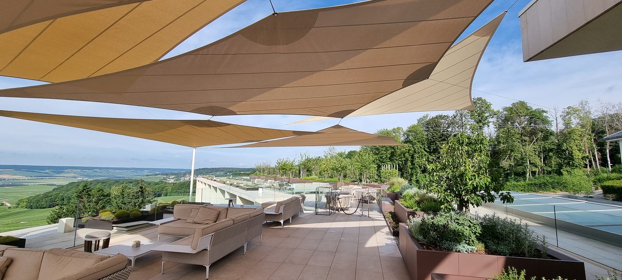 Sand-coloured sails above the vines, Champagne