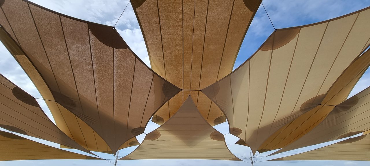 Sand-coloured sails above the vines, Champagne
